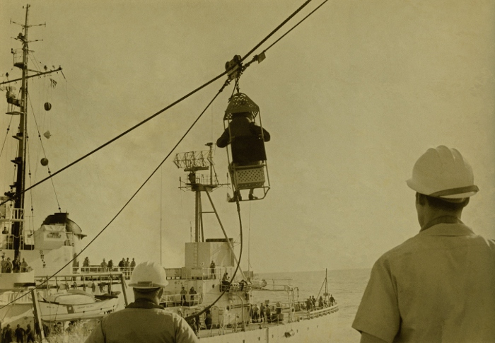 USCGC Winnebago transfering a crewman to another ship.
