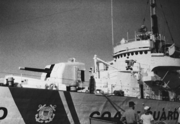Ron Marlett talking with a friend in front of the USCGC Winnebago.