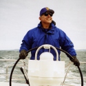 Captain Boyer at the helm of his sailboat.