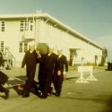 Ron Marlett's friends helping him with his seabag.