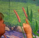 Ron Marlett painting a backdrop for Aniar dance school.