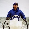 Captain Gary Boyer at the helm of his sailing boat.