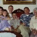 Ron Marlett's nice and her family sitting with Ron's brother and mother.